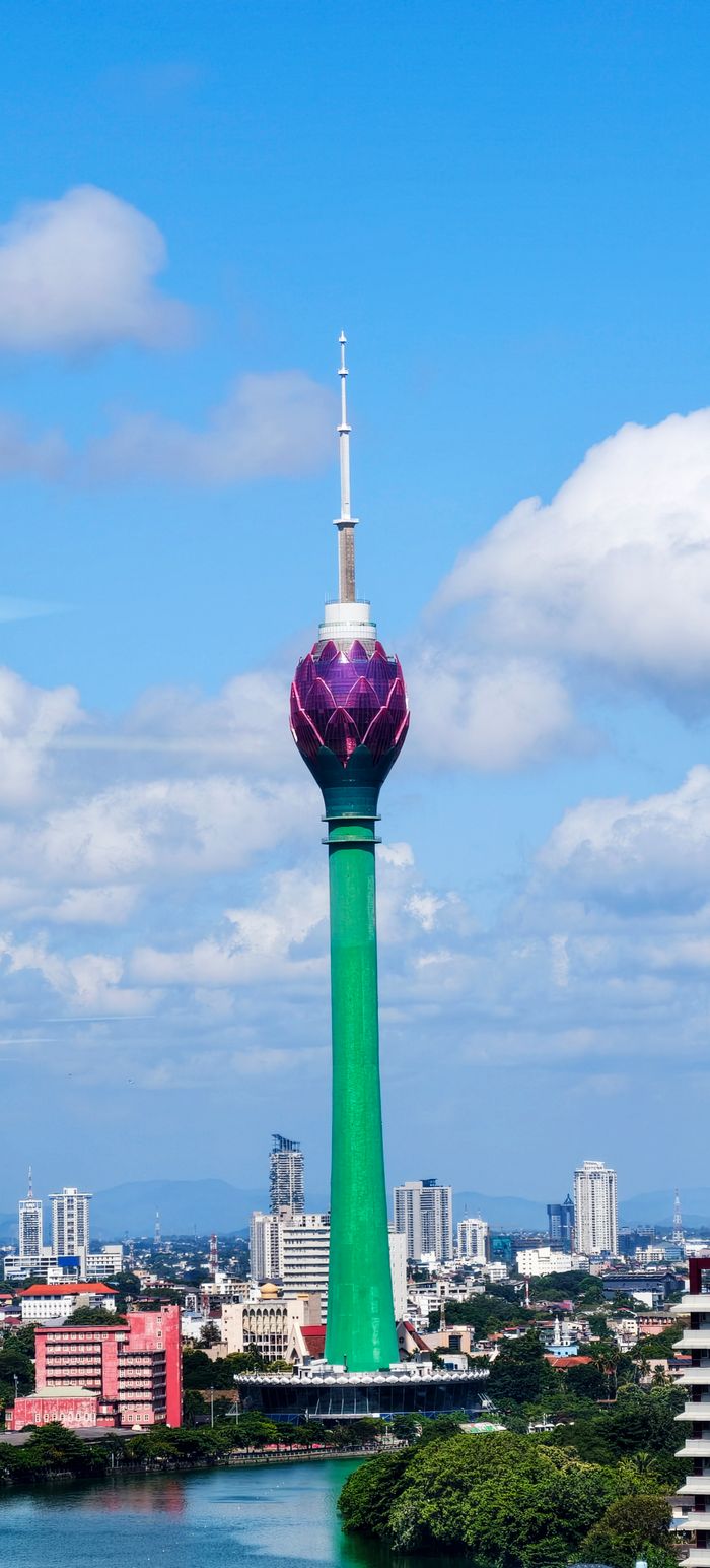 View of the iconic Lotus Tower in Colombo, Sri Lanka on a clear day, surrounded by urban landscape.